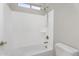 Bathroom with shower-tub combo and chrome fixtures in neutral color palette at 22884 E Via De Olivos --, Queen Creek, AZ 85142