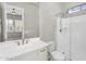 Bathroom vanity and shower with glass door and chrome fixtures in neutral colors at 22884 E Via De Olivos --, Queen Creek, AZ 85142