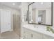 Bathroom boasts a glass enclosed shower, vanity with a framed mirror and sink at 22884 E Via De Olivos --, Queen Creek, AZ 85142