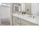 Bright bathroom featuring double sinks, drawers and doors with contemporary hardware at 22884 E Via De Olivos --, Queen Creek, AZ 85142