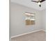 Well-lit bedroom featuring a window overlooking the backyard at 22884 E Via De Olivos --, Queen Creek, AZ 85142