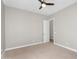 Bedroom featuring neutral paint, carpet, a ceiling fan, and an open doorway at 22884 E Via De Olivos --, Queen Creek, AZ 85142