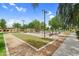 Inviting bocce ball court surrounded by mature trees and landscaping provides a relaxing and recreational community space at 22884 E Via De Olivos --, Queen Creek, AZ 85142