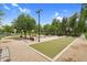 Well-maintained bocce ball court offers a lovely outdoor experience with lush landscaping, benches, and lighting at 22884 E Via De Olivos --, Queen Creek, AZ 85142