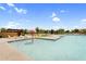 Fun splash pad area at the community pool, featuring colorful seating and a playful umbrella fountain at 22884 E Via De Olivos --, Queen Creek, AZ 85142