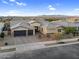 Aerial view of a home featuring desert landscaping and mountain views at 22884 E Via De Olivos --, Queen Creek, AZ 85142