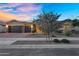 Charming home with a well-maintained front yard, desert landscaping, a brick driveway and a three-car garage at 22884 E Via De Olivos --, Queen Creek, AZ 85142