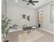 A bright home office featuring carpet floors, neutral paint, a ceiling fan, and a window at 22884 E Via De Olivos --, Queen Creek, AZ 85142