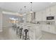 Bright kitchen with quartz countertops, pendant lighting, and a large island perfect for Gathering gatherings at 22884 E Via De Olivos --, Queen Creek, AZ 85142