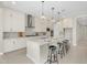 Gourmet kitchen featuring stainless steel appliances, a center island with seating, and ample storage space at 22884 E Via De Olivos --, Queen Creek, AZ 85142