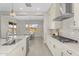 Well-appointed kitchen with modern appliances, sleek countertops, and a view of the adjacent dining area and backyard at 22884 E Via De Olivos --, Queen Creek, AZ 85142