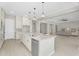 Bright, open kitchen boasts a large island with seating and stainless steel appliances at 22884 E Via De Olivos --, Queen Creek, AZ 85142