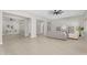 Spacious living area with neutral colors, tile flooring, and ample natural light creating an airy atmosphere at 22884 E Via De Olivos --, Queen Creek, AZ 85142