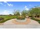 Community park showcasing centerpiece planter, greenery and walking path for outdoor recreation at 22884 E Via De Olivos --, Queen Creek, AZ 85142