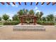 Beautifully landscaped park space with walking paths and ornamental plantings, providing a serene outdoor retreat at 22884 E Via De Olivos --, Queen Creek, AZ 85142