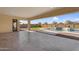 Covered patio area overlooking the backyard, pool and putting green at 22884 E Via De Olivos --, Queen Creek, AZ 85142