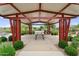 Inviting covered picnic area with tables, landscaping and community gathering space at 22884 E Via De Olivos --, Queen Creek, AZ 85142