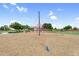Community playground area featuring a rope climbing structure on a wood chip surface at 22884 E Via De Olivos --, Queen Creek, AZ 85142