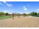 Community playground with swings ready for recreation and fun at 22884 E Via De Olivos --, Queen Creek, AZ 85142
