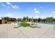 Relaxing pool area featuring lounge chairs, umbrellas, and artificial turf at 22884 E Via De Olivos --, Queen Creek, AZ 85142
