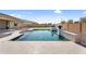 Sparkling pool featuring inviting steps, serene water, and immaculate landscaping, enhancing the backyard's appeal at 22884 E Via De Olivos --, Queen Creek, AZ 85142