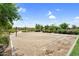 Sandy outdoor volleyball court with net, landscaping, and covered picnic area at 22884 E Via De Olivos --, Queen Creek, AZ 85142