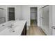 Modern bathroom featuring a sleek vanity, glass-enclosed shower, and convenient access to a closet at 2367 E Rosario Mission Dr, Casa Grande, AZ 85194
