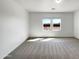Bright bedroom with neutral walls, plush carpeting, and lots of natural light from the windows at 2367 E Rosario Mission Dr, Casa Grande, AZ 85194