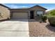 Charming single-story home featuring a two-car garage and low-maintenance desert landscaping at 2367 E Rosario Mission Dr, Casa Grande, AZ 85194