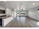 Bright, open concept living space showcasing modern finishes, a large island, and neutral tones at 2367 E Rosario Mission Dr, Casa Grande, AZ 85194