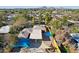 An aerial view showcasing a home with mature trees, backyard patio, and mountain backdrop at 2511 E Pinchot Ave, Phoenix, AZ 85016