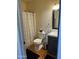 Cozy bathroom featuring tiled floors, a vanity with a mirror, and a shower with curtain at 2511 E Pinchot Ave, Phoenix, AZ 85016