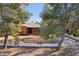 Charming brick home with well-maintained landscaping and mature trees, complemented by a gated yard at 2511 E Pinchot Ave, Phoenix, AZ 85016