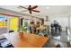 Open floor plan features industrial-style kitchen with stainless steel appliances and a view into the dining and living areas at 2511 E Pinchot Ave, Phoenix, AZ 85016