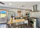 Contemporary kitchen features stainless steel appliances, an island, and a large window over looking the backyard at 2511 E Pinchot Ave, Phoenix, AZ 85016
