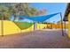The property features an inviting backyard patio with a shade sail and water feature at 2511 E Pinchot Ave, Phoenix, AZ 85016