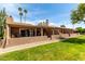 Lush backyard with a private patio, perfect for outdoor entertaining and relaxation at 25238 S Mohawk Dr, Sun Lakes, AZ 85248