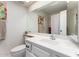 Bright bathroom with a large mirror, neutral walls, and classic fixtures at 25238 S Mohawk Dr, Sun Lakes, AZ 85248