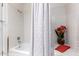 Cozy bathroom featuring a clean white tub and shower with decorative accents at 25238 S Mohawk Dr, Sun Lakes, AZ 85248
