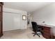 Neutral bedroom featuring a functional desk area and ample closet space at 25238 S Mohawk Dr, Sun Lakes, AZ 85248