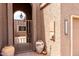 Inviting gated entry with potted plants and a lantern creating a warm and welcoming ambiance at 25238 S Mohawk Dr, Sun Lakes, AZ 85248