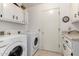 Efficient laundry area featuring modern appliances and ample storage at 25238 S Mohawk Dr, Sun Lakes, AZ 85248