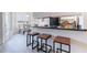 Open kitchen showcasing bar seating and flowing seamlessly into the adjacent dining area at 255 S Kyrene Rd # 212, Chandler, AZ 85226