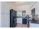 Bright kitchen with stainless steel appliances, granite countertops, and a view of the backyard at 255 S Kyrene Rd # 212, Chandler, AZ 85226