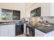 Bright kitchen features stainless steel appliances, granite countertops, and a large window overlooking the backyard at 255 S Kyrene Rd # 212, Chandler, AZ 85226