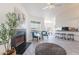 Spacious living room featuring a fireplace, dining area, kitchen and large windows at 255 S Kyrene Rd # 212, Chandler, AZ 85226