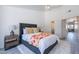 Bright main bedroom with soft carpet, and a luxurious bed with a colorful floral throw at 255 S Kyrene Rd # 212, Chandler, AZ 85226