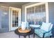 Comfortable patio features a cozy seating area with a table, perfect for relaxing outdoors at 255 S Kyrene Rd # 212, Chandler, AZ 85226