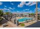 Community pool area featuring a pool and lounge chairs at 255 S Kyrene Rd # 212, Chandler, AZ 85226