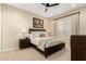 Cozy bedroom with plush bedding, neutral tones, and stylish lamps providing a relaxing ambiance at 26999 W Ponderosa Ln, Buckeye, AZ 85396
